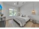 Bright bedroom featuring a large bed, wood floors and a stylish wall accent at 105 6Th S St, Bradenton Beach, FL 34217