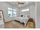 Cozy bedroom with large windows, wood floors and a ceiling fan at 105 6Th S St, Bradenton Beach, FL 34217