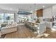 Open concept kitchen and dining area with modern design and island seating at 105 6Th S St, Bradenton Beach, FL 34217
