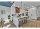 Modern kitchen with white cabinets, marble countertops, and a large island at 105 6Th S St, Bradenton Beach, FL 34217