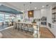 Modern kitchen with a large island, white cabinets and a blue ceiling at 105 6Th S St, Bradenton Beach, FL 34217
