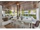 Outdoor dining area with pool and wooden ceiling at 105 6Th S St, Bradenton Beach, FL 34217