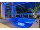 Night view of a lighted pool and spa area at 105 6Th S St, Bradenton Beach, FL 34217