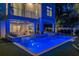 Luxury pool and spa at night with lighting and landscaping at 105 6Th S St, Bradenton Beach, FL 34217