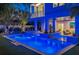 Luxury pool and spa at night with lighting and landscaping at 105 6Th S St, Bradenton Beach, FL 34217