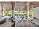 Outdoor dining area with pool and wooden ceiling at 105 6Th S St, Bradenton Beach, FL 34217