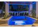 Night view of a lighted pool and spa area at 105 6Th S St, Bradenton Beach, FL 34217