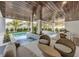 Covered patio with seating area and a view of the pool at 105 6Th S St, Bradenton Beach, FL 34217