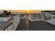 Spacious rooftop deck with ocean views, featuring composite decking and white railing at 105 6Th S St, Bradenton Beach, FL 34217