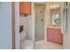 Small bathroom with shower and pink vanity at 1051 Truman St, Nokomis, FL 34275