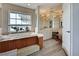 Bathroom with a large soaking tub, walk-in shower, and double vanity at 1051 Truman St, Nokomis, FL 34275