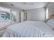 Main bedroom with white bedding and a ceiling fan at 1051 Truman St, Nokomis, FL 34275