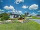 Gated community entrance with landscaping at 1051 Truman St, Nokomis, FL 34275