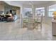 Bright dining area with glass table and wicker buffet at 1051 Truman St, Nokomis, FL 34275