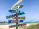 Colorful directional sign to various cities at 1051 Truman St, Nokomis, FL 34275
