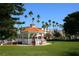 White gazebo in a lush green park setting at 1051 Truman St, Nokomis, FL 34275