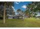 House exterior view with backyard and canal at 1051 Truman St, Nokomis, FL 34275