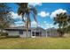 House exterior view with pool and palm trees at 1051 Truman St, Nokomis, FL 34275
