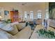Open living room with ample natural light, comfortable seating, and access to other rooms at 1051 Truman St, Nokomis, FL 34275