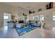 Spacious living room with high ceilings, fireplace, and ample natural light at 1051 Truman St, Nokomis, FL 34275