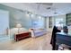 Home office featuring a couch, built-in shelving, and hardwood floors at 1051 Truman St, Nokomis, FL 34275
