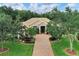 Property showcasing a large house and a well-maintained lawn at 11432 Savannah Lakes Dr, Parrish, FL 34219