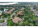 Aerial view of a luxury home community with waterfront and golf course views at 11432 Savannah Lakes Dr, Parrish, FL 34219