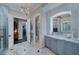 Elegant bathroom with marble vanity, large shower, and walk-in closet at 11432 Savannah Lakes Dr, Parrish, FL 34219