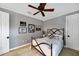 Well-lit bedroom with a metal bed frame and window shutters at 11432 Savannah Lakes Dr, Parrish, FL 34219