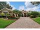 Beautiful home with a large driveway and lush landscaping at 11432 Savannah Lakes Dr, Parrish, FL 34219