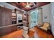 Spacious home office with built-in cabinetry and hardwood floors at 11432 Savannah Lakes Dr, Parrish, FL 34219