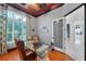 Bright home office features built-in shelving and hardwood floors at 11432 Savannah Lakes Dr, Parrish, FL 34219