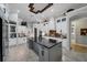Modern kitchen with white cabinetry, granite countertops, and high-end appliances at 11432 Savannah Lakes Dr, Parrish, FL 34219