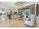 Spacious living room with a fireplace and access to the backyard pool at 11432 Savannah Lakes Dr, Parrish, FL 34219