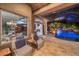 Comfortable patio seating area with views of the pool and dining area at 11432 Savannah Lakes Dr, Parrish, FL 34219