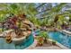 Stunning pool with waterfall and tropical landscaping at 11432 Savannah Lakes Dr, Parrish, FL 34219