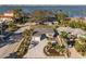 Aerial view of a single Gathering home with landscaped yard and driveway at 120 Edgewater Ter, Dunedin, FL 34698