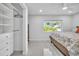 Main bedroom with walk-in closet and window views at 120 Edgewater Ter, Dunedin, FL 34698