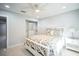Bright bedroom with queen bed and built-in closet at 120 Edgewater Ter, Dunedin, FL 34698