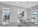 Open concept dining area with kitchen and office views at 120 Edgewater Ter, Dunedin, FL 34698