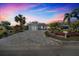 Modern single story home with landscaped yard and paver driveway at 120 Edgewater Ter, Dunedin, FL 34698