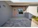 Renovated front entry features a pink door and a covered porch at 120 Edgewater Ter, Dunedin, FL 34698