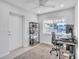 Home office with desk, chair, and built-in shelving at 120 Edgewater Ter, Dunedin, FL 34698