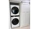 Laundry room with stackable washer and dryer at 120 Edgewater Ter, Dunedin, FL 34698