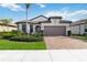 Attractive one-story home with a two-car garage and landscaped front yard at 12458 Marsh Pointe Rd, Sarasota, FL 34238