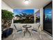 Private balcony with outdoor seating, offering scenic views at sunset at 1255 N Gulfstream Ave # 204, Sarasota, FL 34236