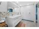 Modern bathroom with double vanity, stone mosaic, and walk-in shower at 1255 N Gulfstream Ave # 204, Sarasota, FL 34236