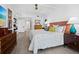 Bedroom with a coffered ceiling, wood floors, and two wooden chests at 1255 N Gulfstream Ave # 204, Sarasota, FL 34236