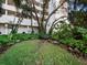 Relaxing courtyard with lush landscaping and a bench at 1255 N Gulfstream Ave # 204, Sarasota, FL 34236