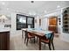 Elegant dining room featuring a wood table and statement light fixture at 1255 N Gulfstream Ave # 204, Sarasota, FL 34236